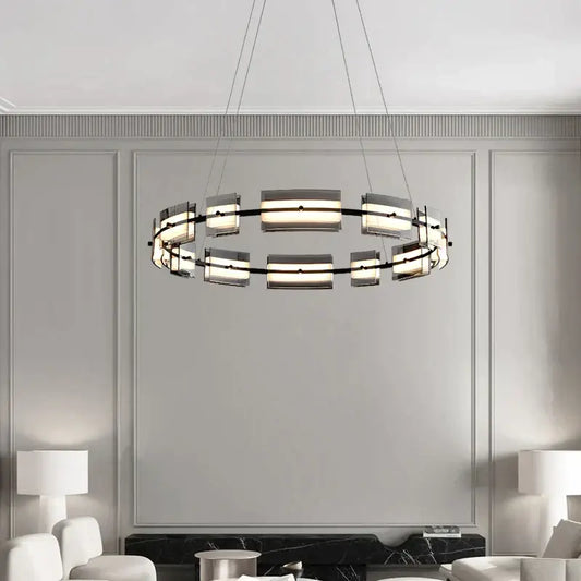 Modern black glass restaurant chandelier with sleek metal frame and frosted panels emitting warm light for dining room