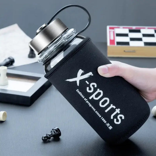 Modern black glass tea bottle travel flask with neoprene sleeve and x-sports branding by decorbites