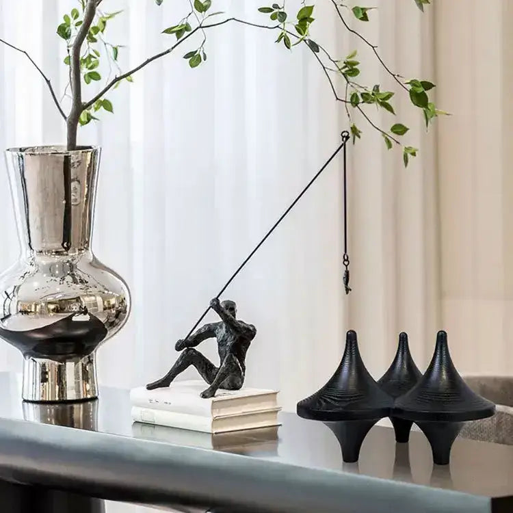 A sleek metallic silver vase with a reflective surface ideal for modern black glossy decorbites geometric gyroscope decor
