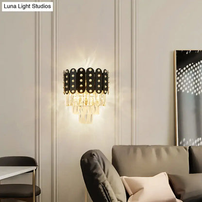 Modern black and gold 3-tiered wall-mounted light with clear faceted crystal droplets and circular embellishments