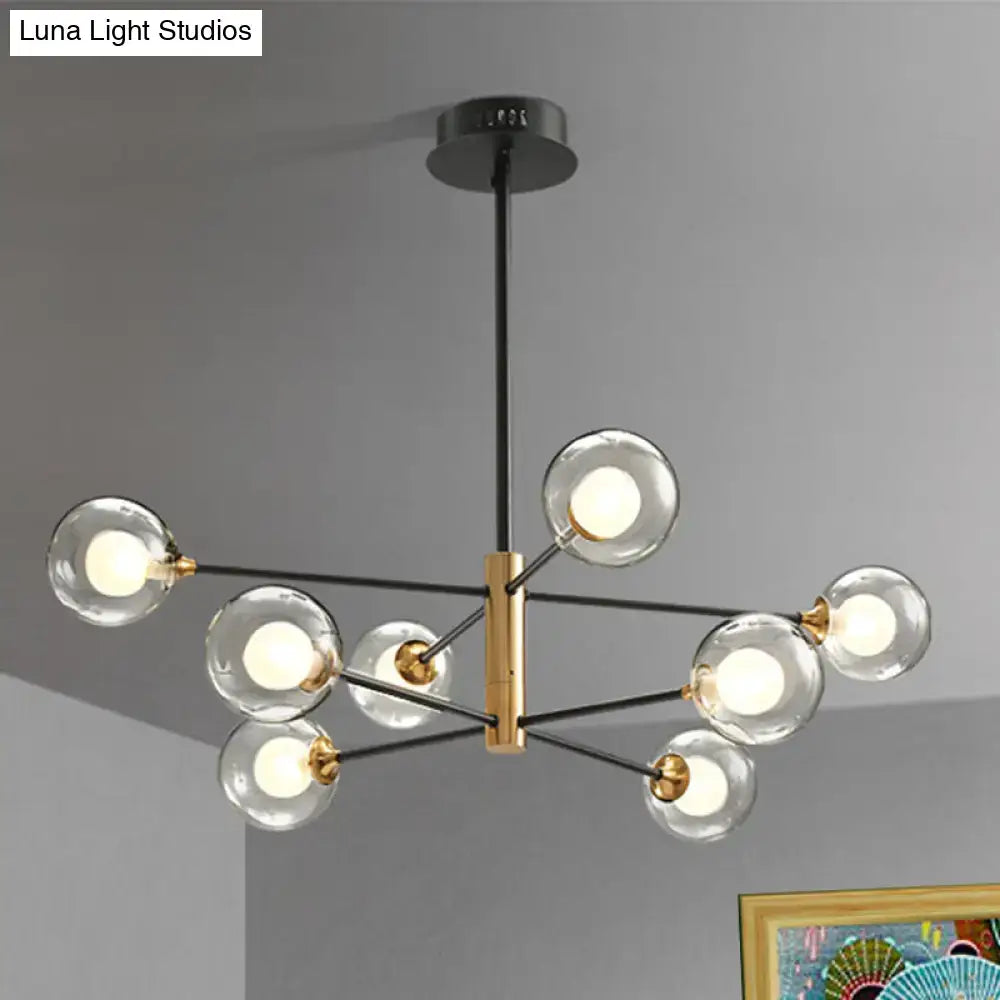 DecorBites modern black and gold 8-light chandelier offers clear glass globes on a brass rectangular frame with 32-inch fixture width