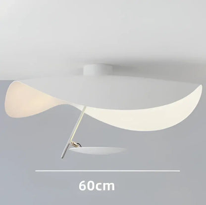A modern black and gold pendant lamp with a flowing white translucent shade and slender metallic arm for dining room decorbites lederam manta pendant