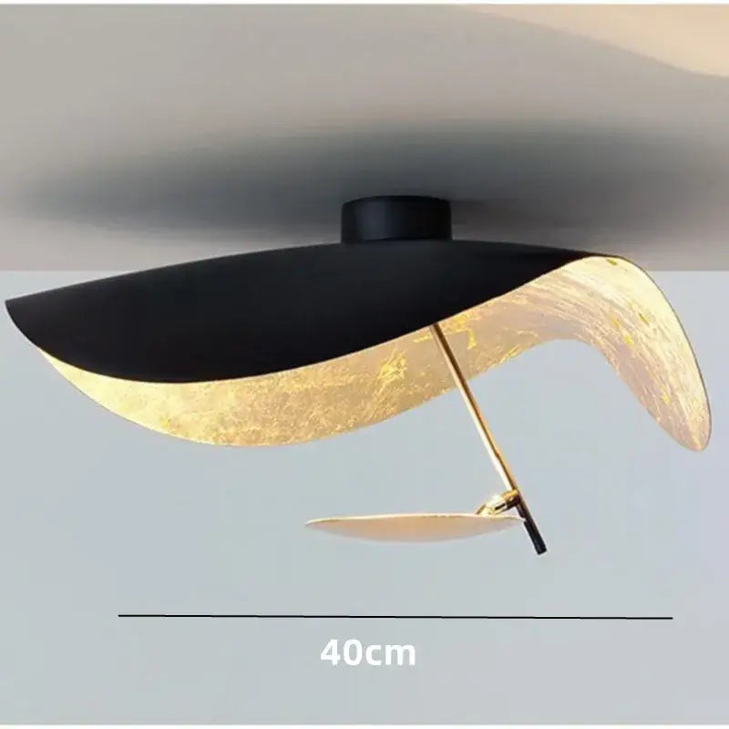 Modern black and gold leaf-shaped pendant lamp with 40cm diameter sculptural design by decorbites lederam manta