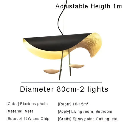 Modern black and gold metallic pendant lamp with sleek curved design for sculptural dining room decorbites lederam manta