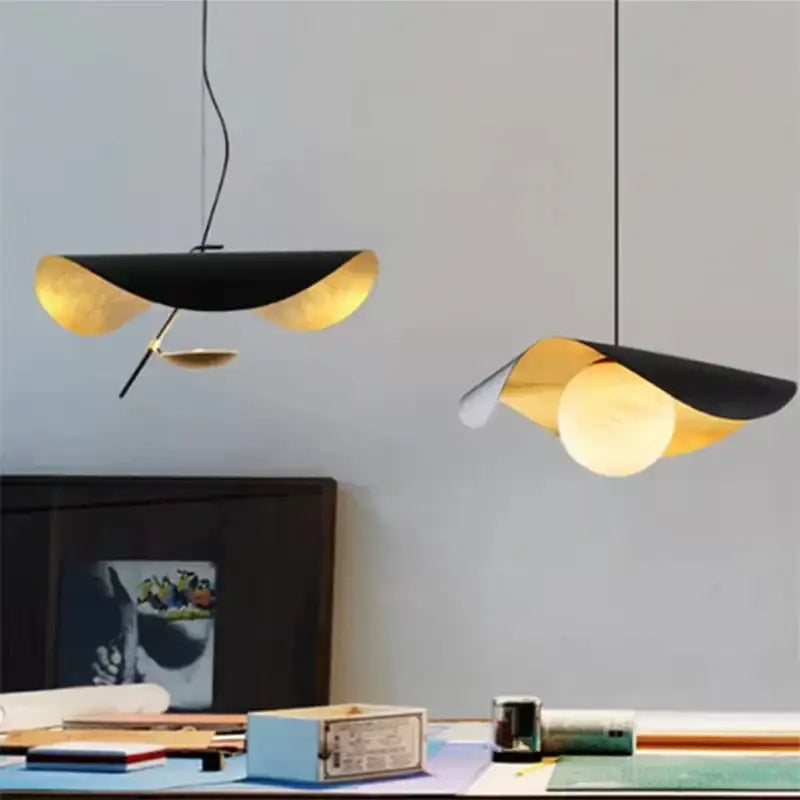 Modern black and gold abstract lederam manta pendant light with sculptural design for dining room decorbites lederam manta