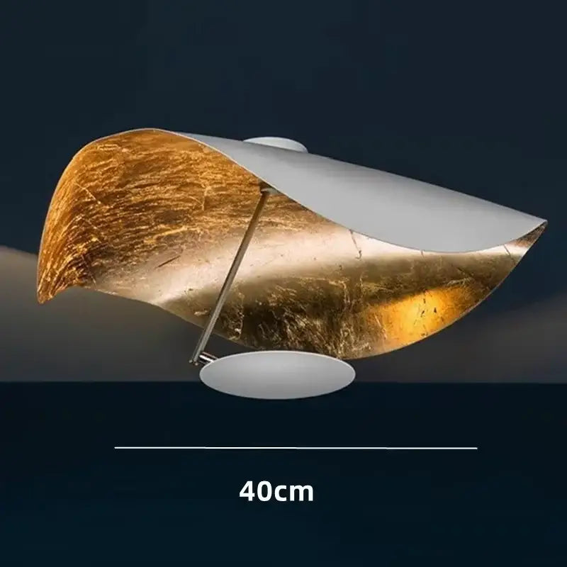 Modern black and gold abstract sculptural pendant light with gold-leaf and white matte finish for dining room decorbites lederam manta