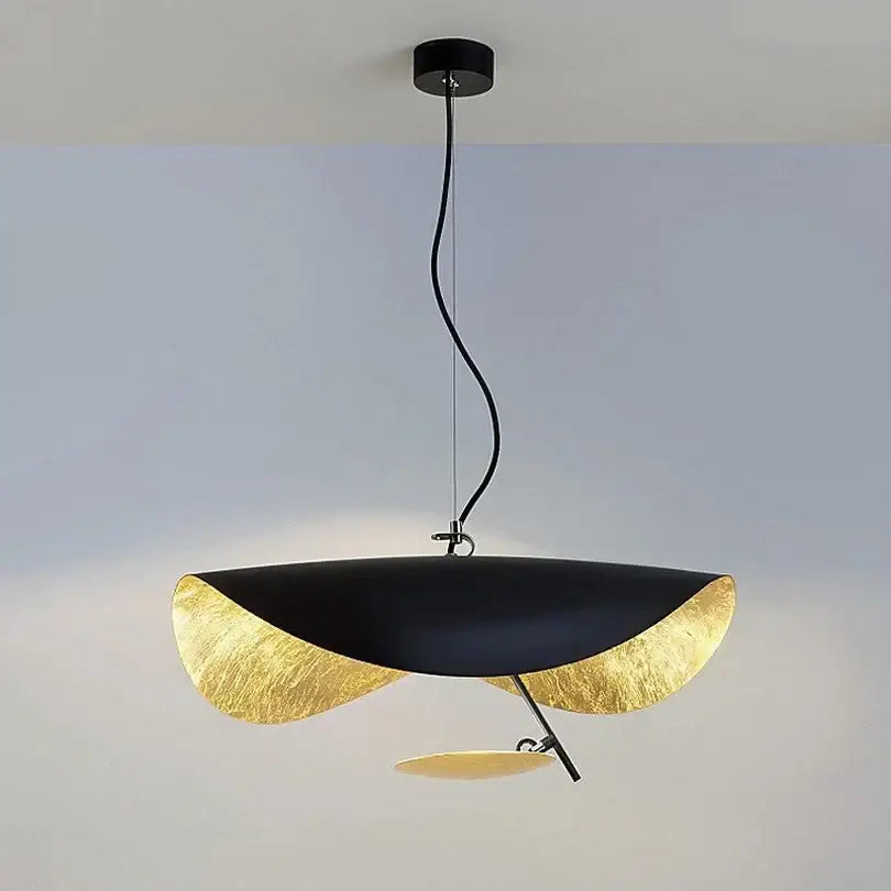 Modern black and gold abstract lederam manta pendant light with leaf-shaped design ideal for dining room decorbites lederam
