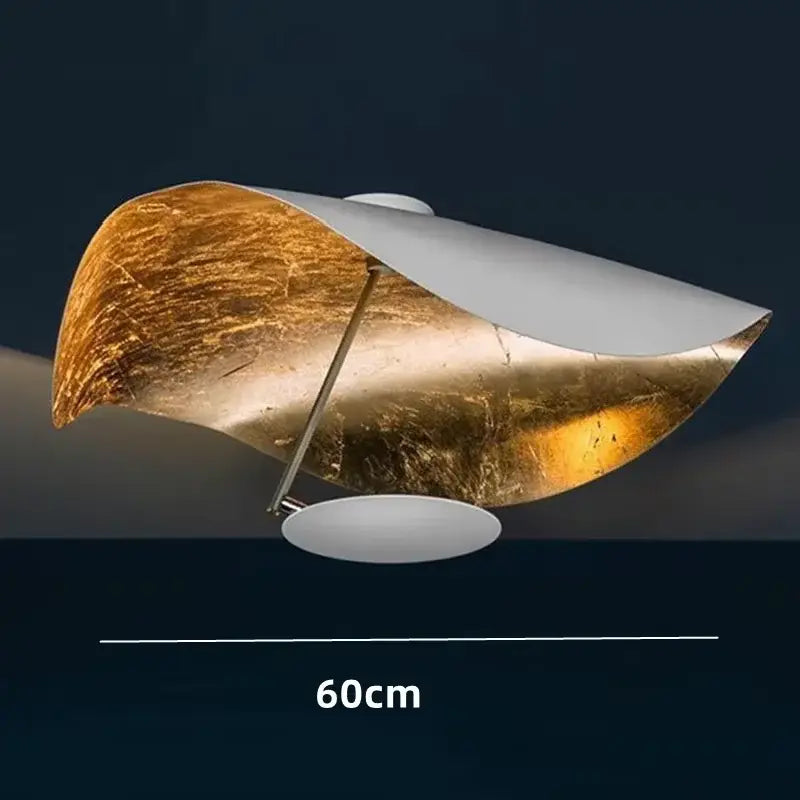 Modern black and gold abstract lederam manta pendant light with curved gold leaf and white metal for dining room decorbites lederam