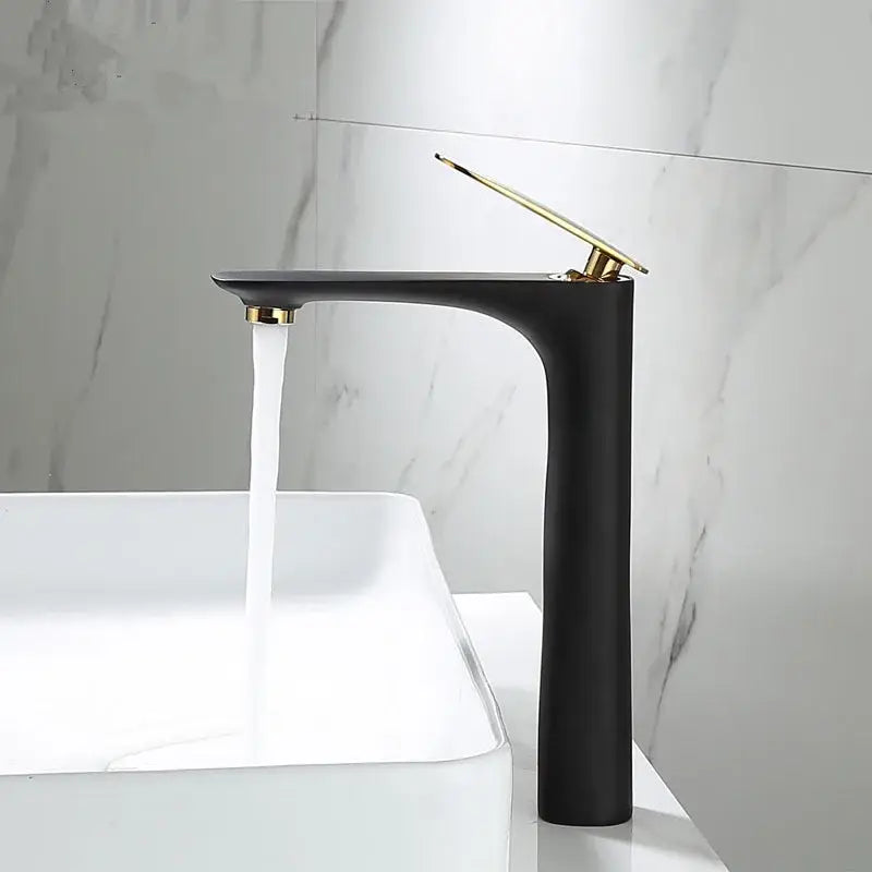 Modern black and gold basin faucet with matte finish and sleek design by decorbites for bathroom sinks