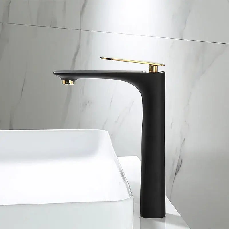 Modern black and gold basin faucet with matte finish and gold accents for bathroom sinks by decorbites black