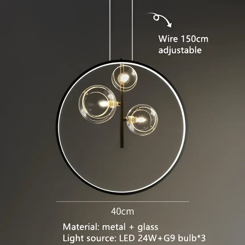 Modern black and gold branching bubbles chandelier with three clear glass globes in a sleek metal frame for dining room decor