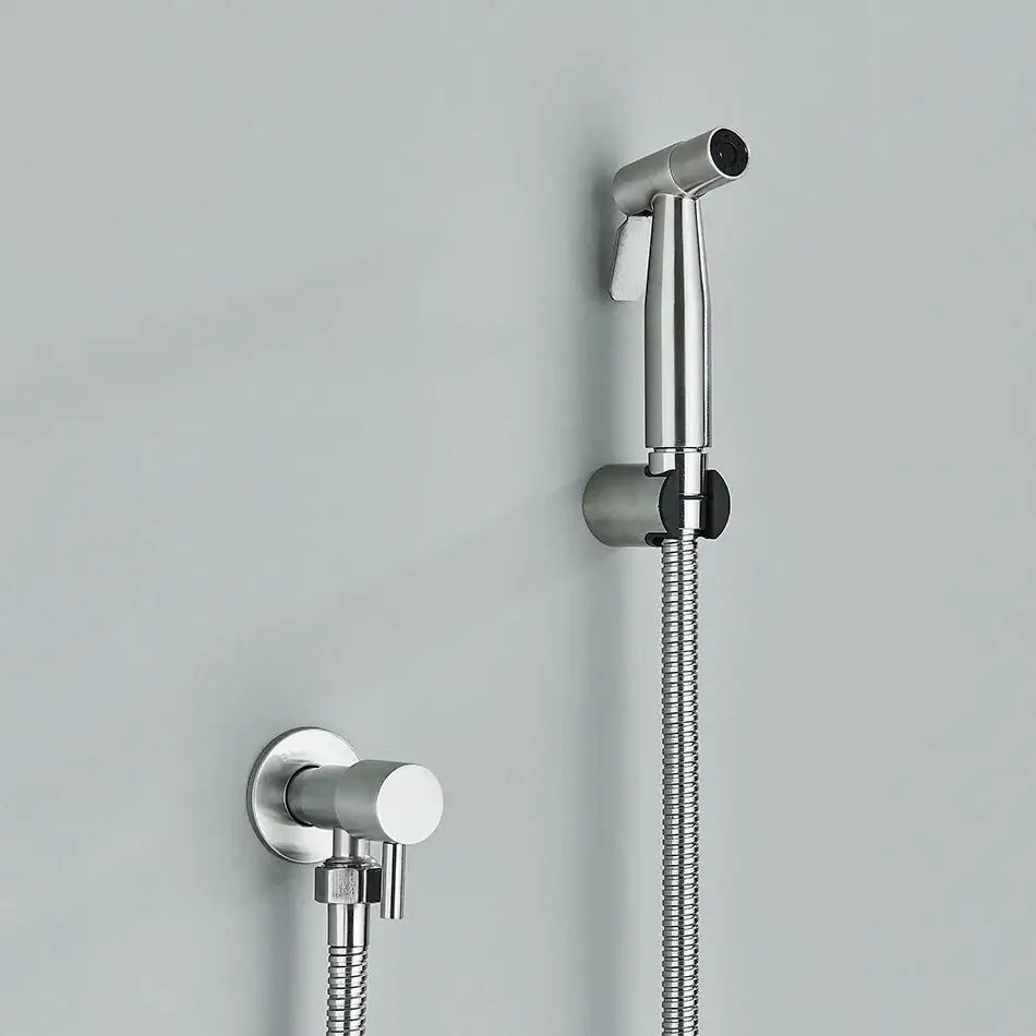 Modern black and gold brass bidet faucet with a chrome handheld showerhead featuring black grip and flexible hose decorbites brass bidet