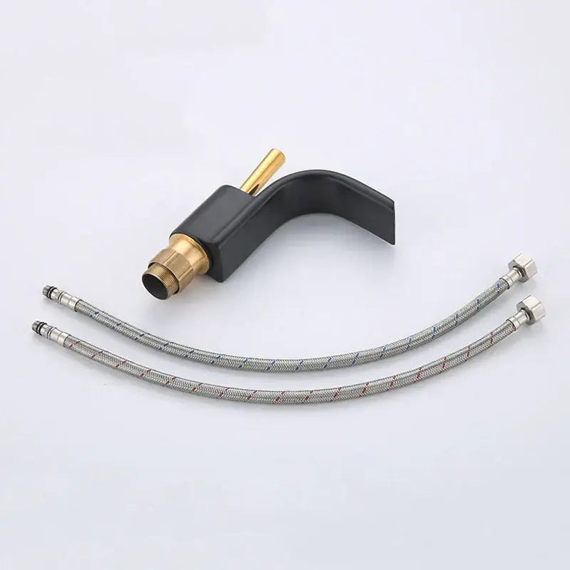 Modern black brass waterfall basin faucet with brass accents and two silver braided hoses by decorbites