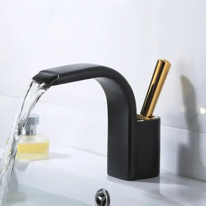 Modern black brass waterfall basin faucet with black matte finish and gold tone handle by decorbites for bathroom sink
