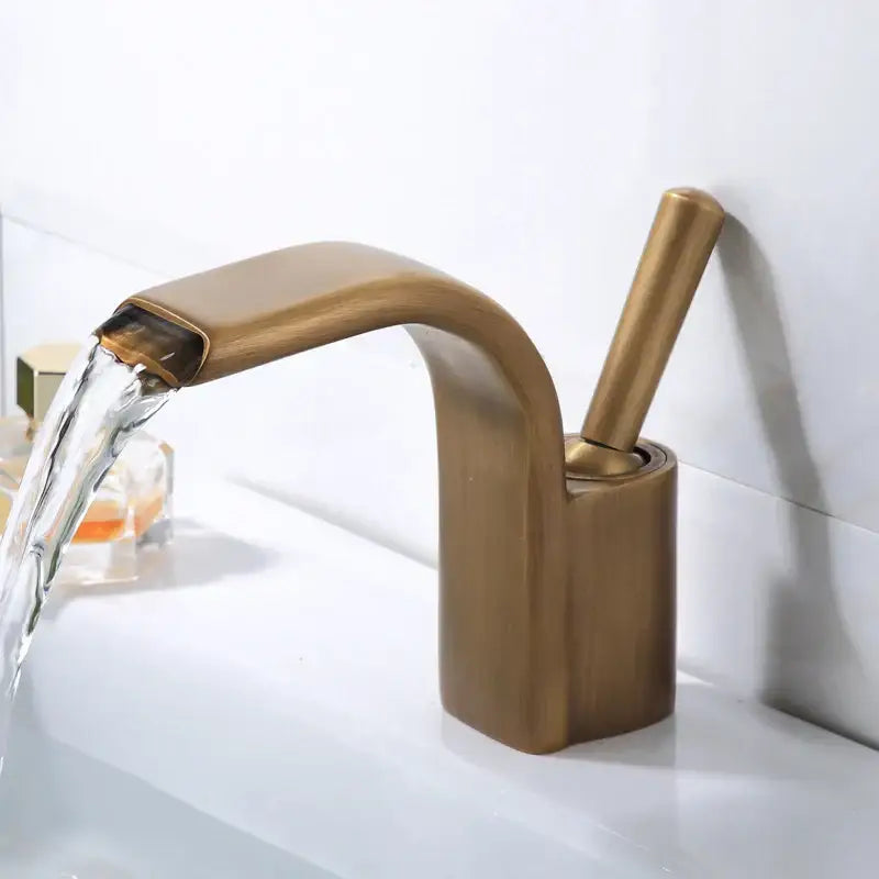 Modern black brass waterfall basin faucet with brass finish curved spout and cylindrical handle by decorbites black brass