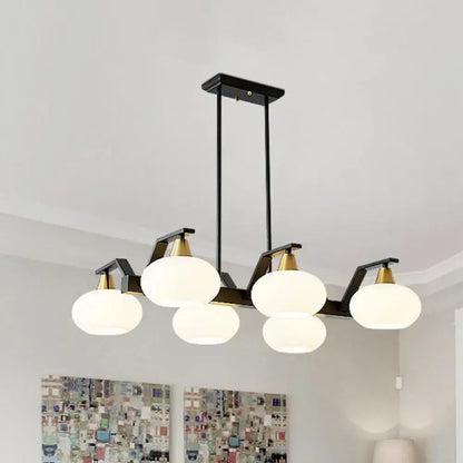 DecorBites black modern chandelier with brass fixture height and five frosted white oval glass shades 220v-240v compatible