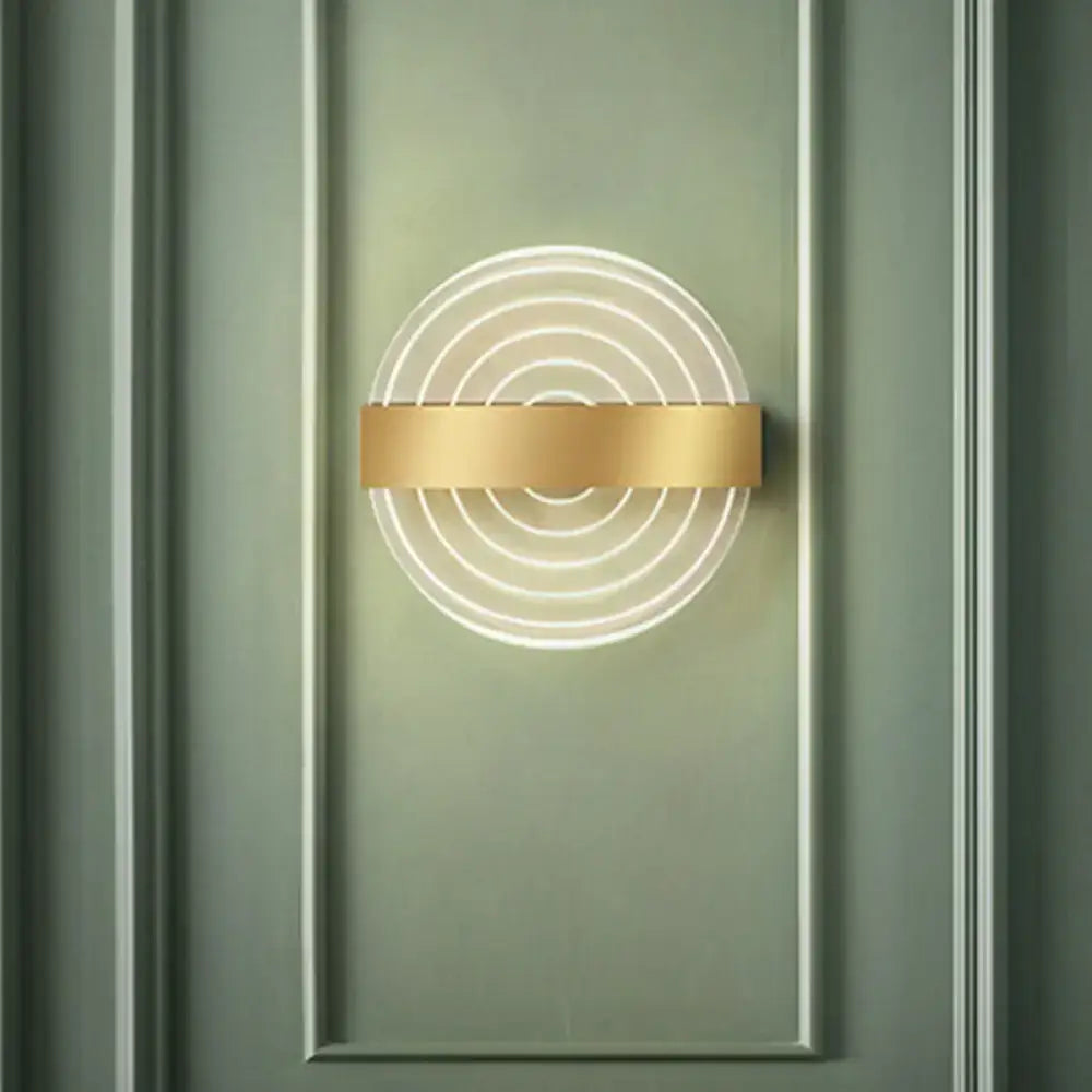 Modern black and gold circle led wall lamp with concentric glowing rings and polished gold bar ideal choice for living room