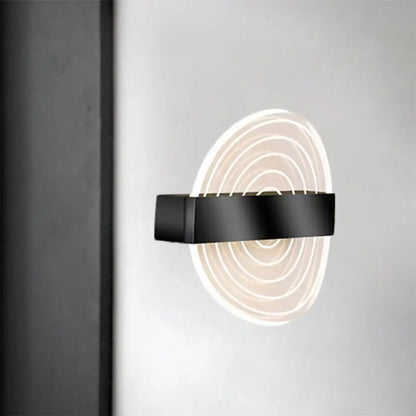 Modern black and gold wall lamp with concentric circular led light rings ideal choice for living room lighting