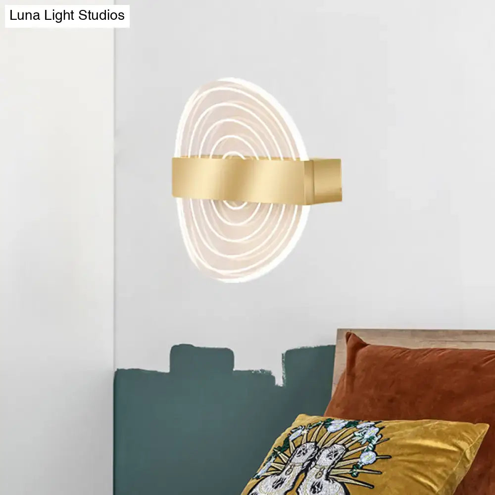 Modern black and gold wall lamp with concentric circular led rings, an ideal choice for stylish living room lighting