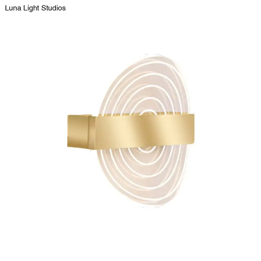 Modern black and gold wall lamp featuring gold-toned concentric circular LED light patterns ideal choice for living room