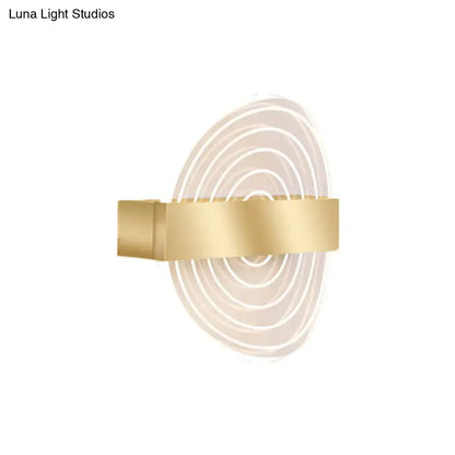 Modern black and gold wall lamp featuring gold-toned concentric circular LED light patterns ideal choice for living room