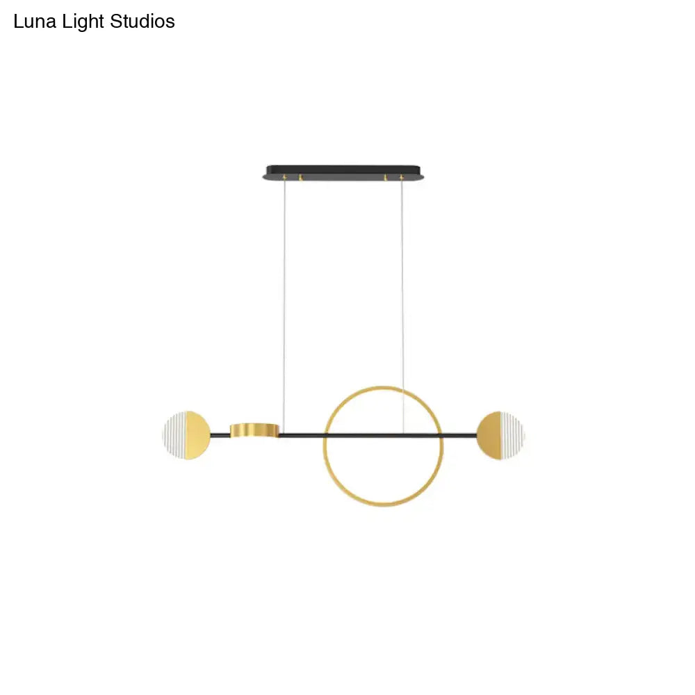 Modern minimalist pendant light with gold and white half-moon accents and circle metal island design for dining room