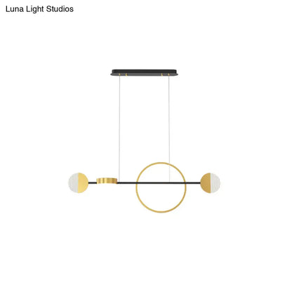 Modern minimalist pendant light with gold and white half-moon accents and circle metal island design for dining room