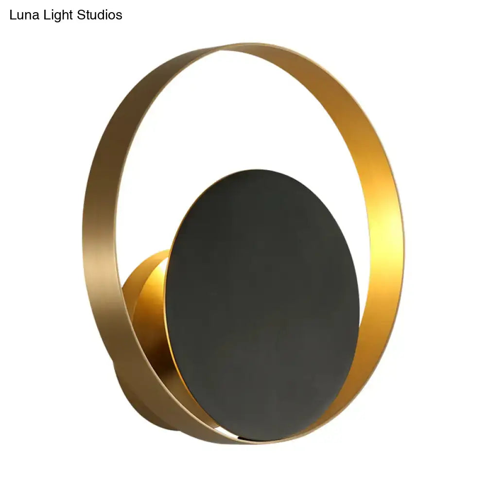 Modern black and gold circular led wall sconce with gold-toned ring and matte black oval panel wall lamp for bedrooms