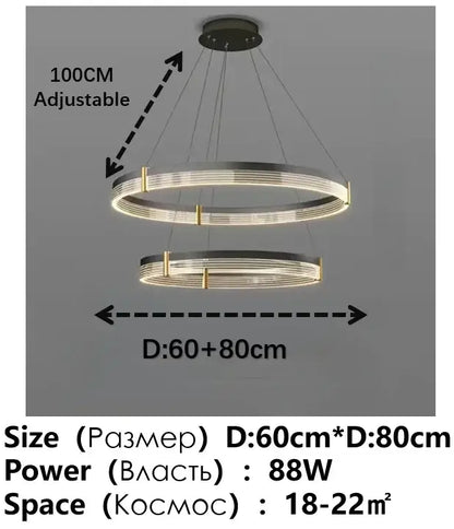 Modern black and gold circular pendant light featuring sleek metallic rings with warm glowing black acrylic led decorbites design