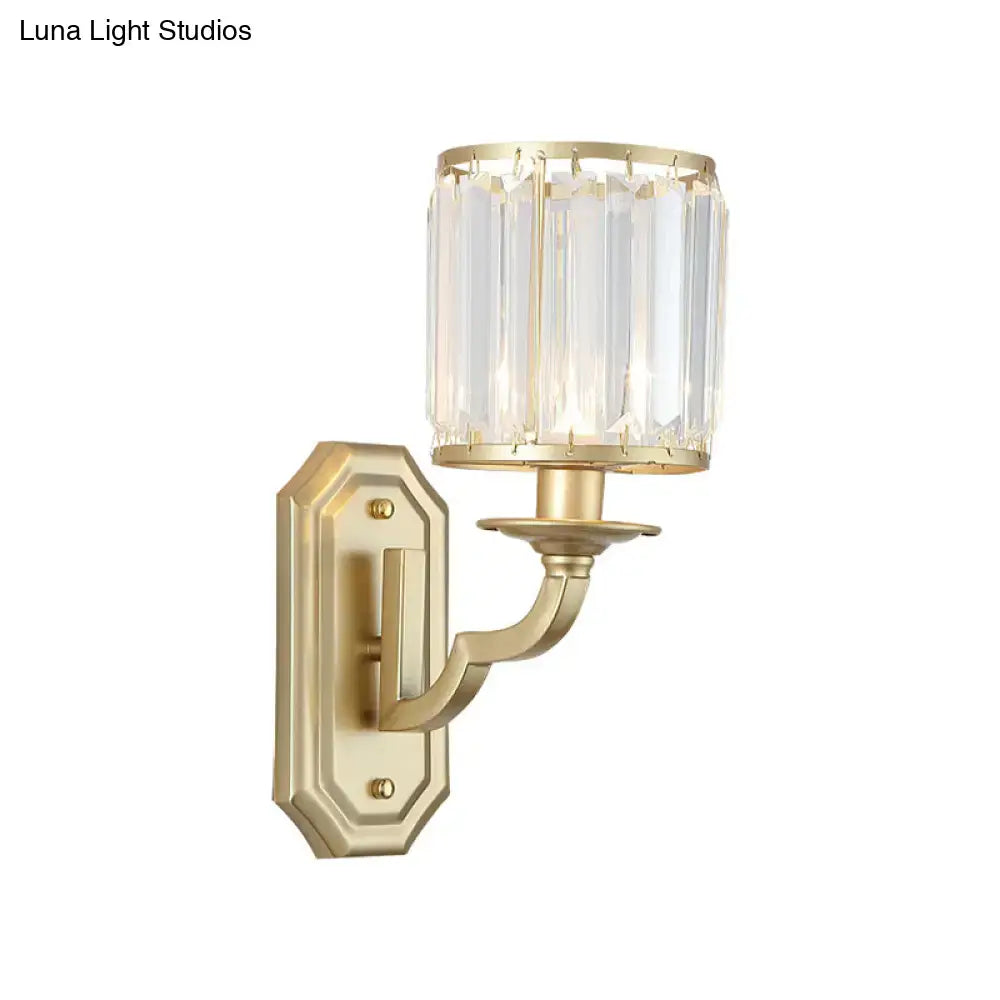 Modern black gold clear crystal wall sconce with cylindrical shade and fixture height ideal for bedroom lighting