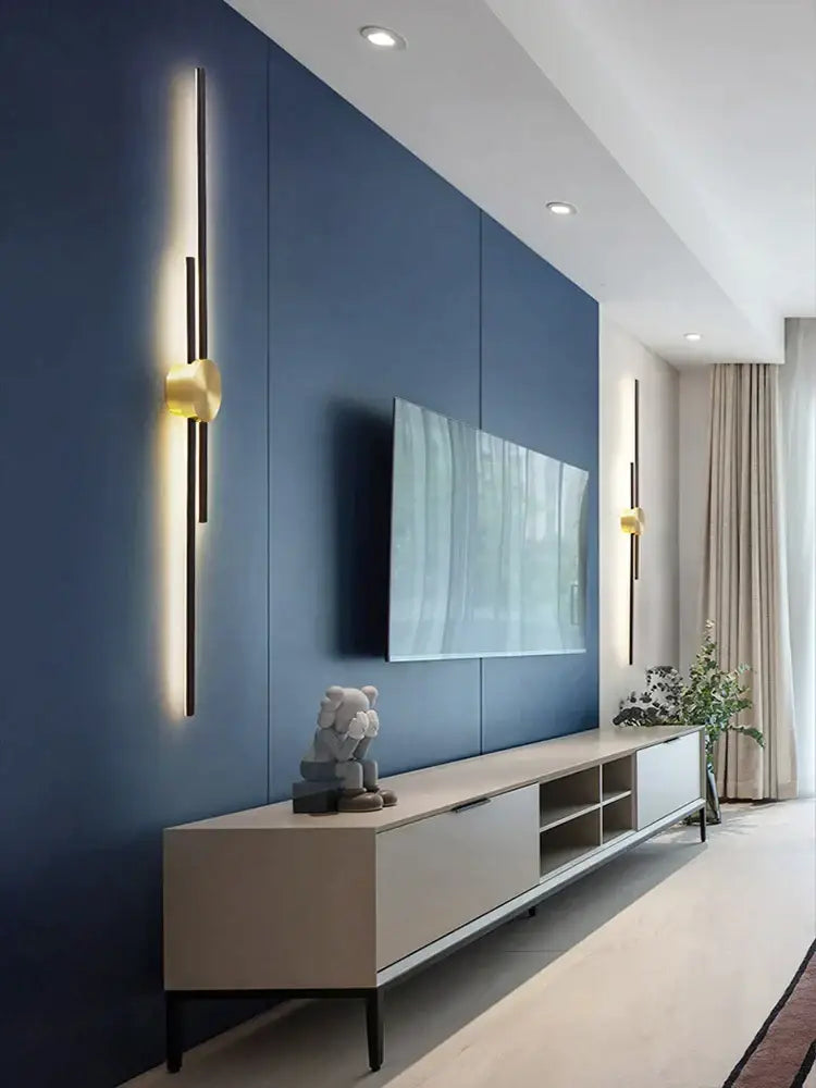 Modern minimalist tv console with sleek beige finish and black legs under decorbites copper wall light bedroom sconce