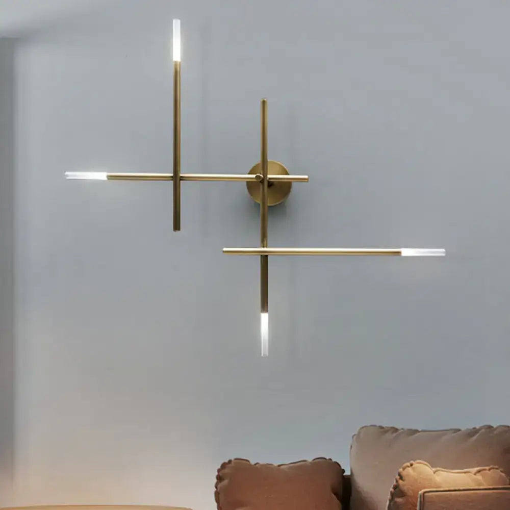 Modern black and gold brass wall light with crossed lines and slim led light strips for bedroom lighting fixture
