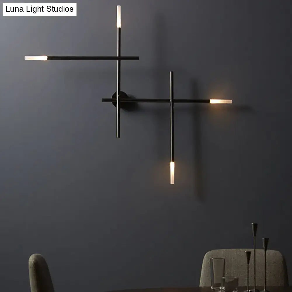 Modern black metal wall light with gold crossed lines design and warm led lighting for bedroom fixture