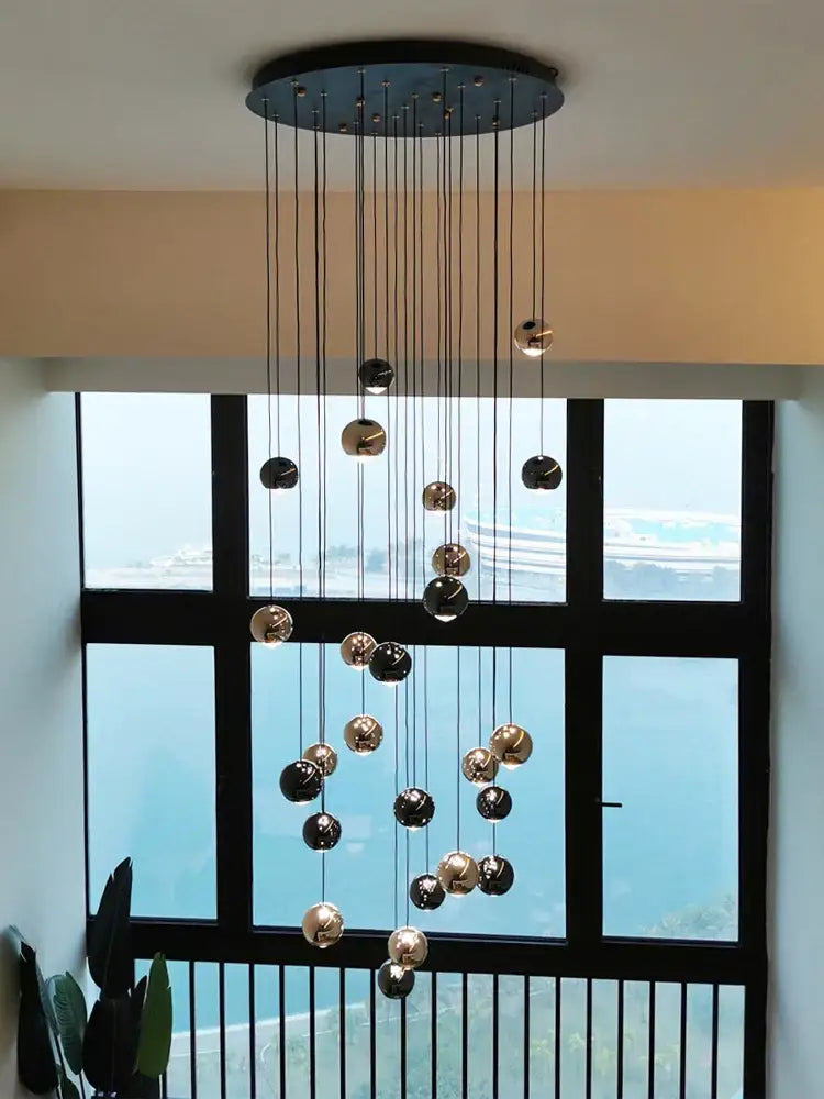 Modern black and gold pendant light with spherical glass orbs from decorbites crystal ball pendant collection