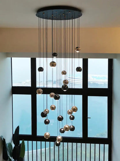 Modern black and gold pendant light with spherical glass orbs from decorbites crystal ball pendant collection