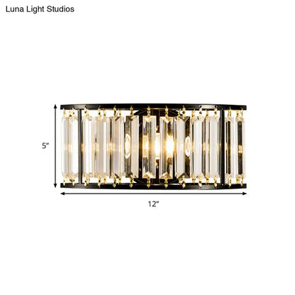 Modern black and gold crystal half cylinder wall sconce with clear crystal half prisms for bedroom lighting using led or incandescent bulbs