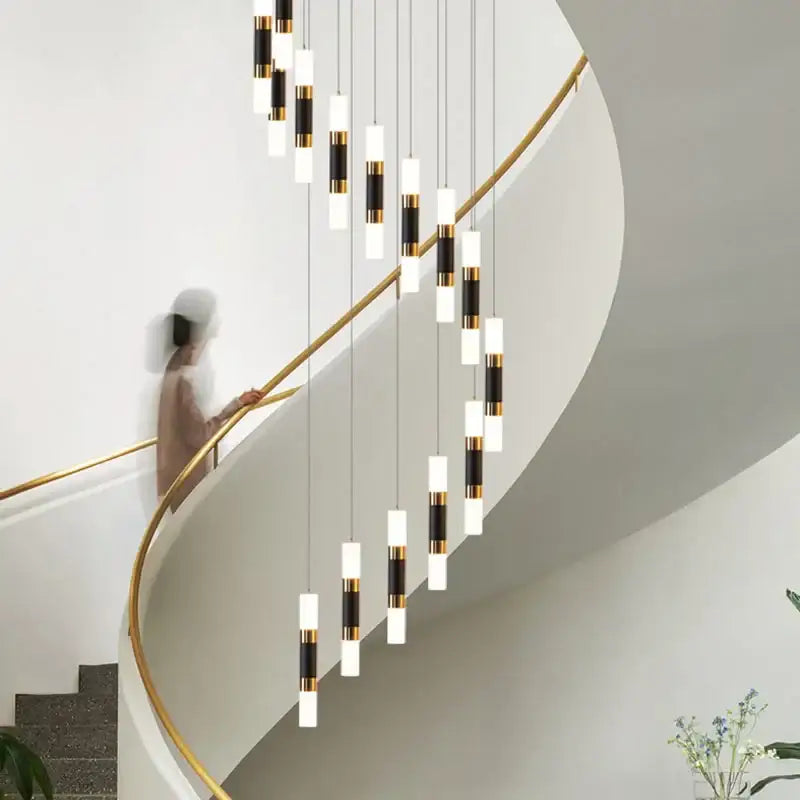 Modern black and gold crystal led chandelier staircase pendant light by decorbites featuring cascading cylindrical design
