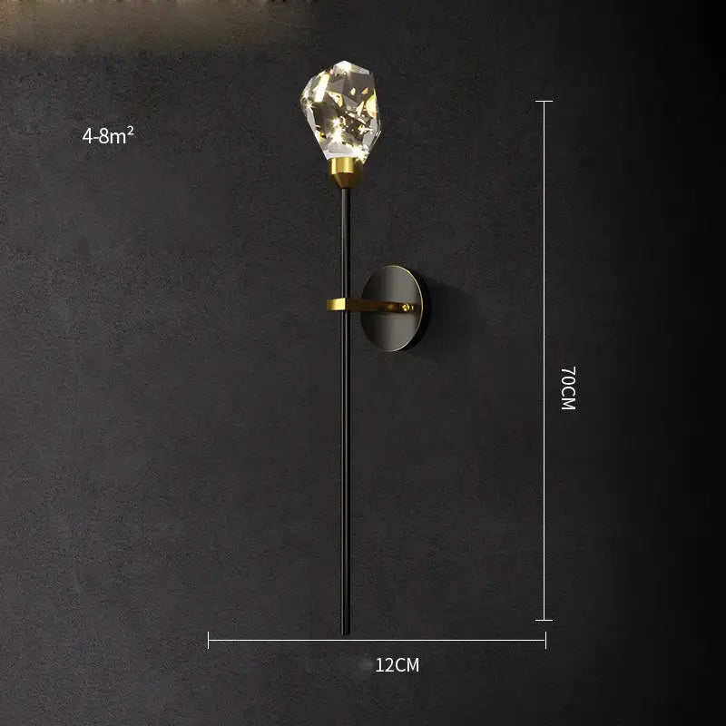 Modern black and gold wall sconce featuring a faceted decorbites crystal led bulb and sleek metal accents for bedroom light