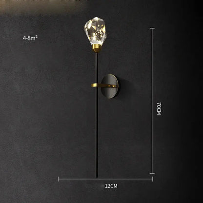 Modern black and gold wall sconce featuring a faceted decorbites crystal led bulb and sleek metal accents for bedroom light