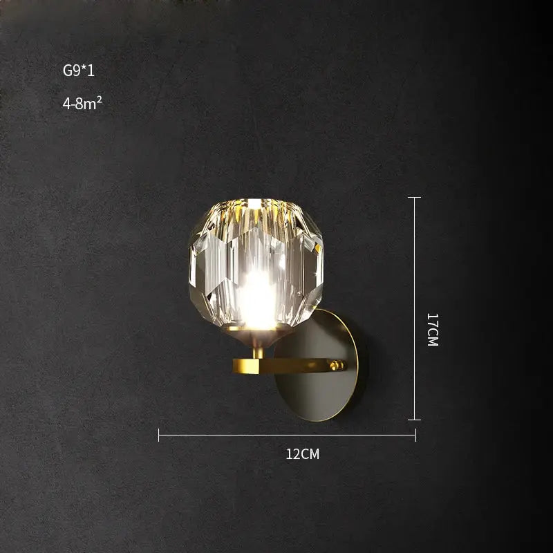 Modern black and gold decorbites crystal led wall sconce with faceted crystal globe and metal base for bedroom light