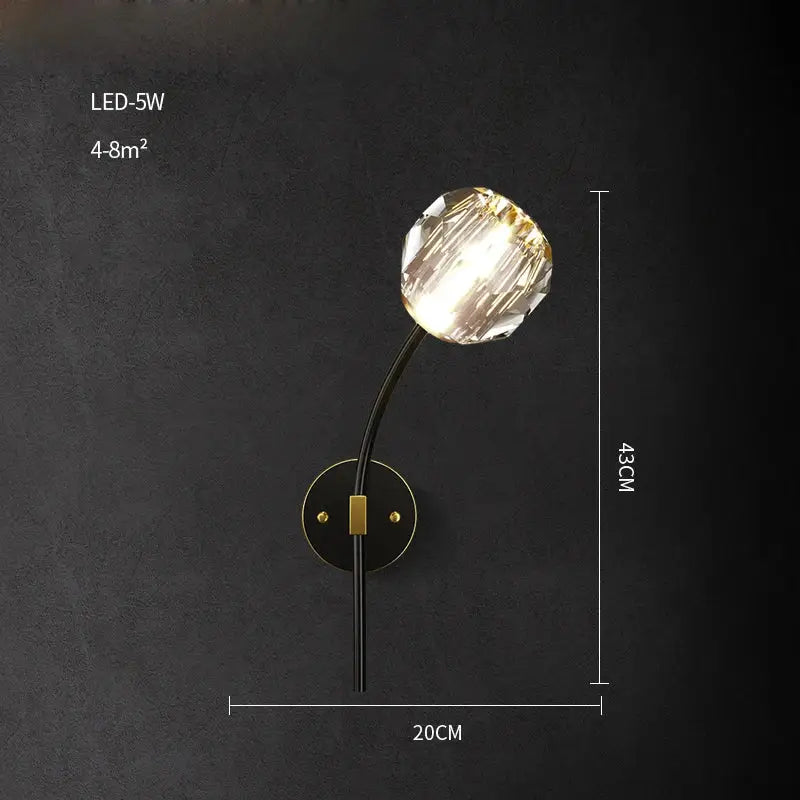 Modern black and gold crystal led wall sconce with faceted globe on sleek curved arm for bedroom decorbites crystal led lighting