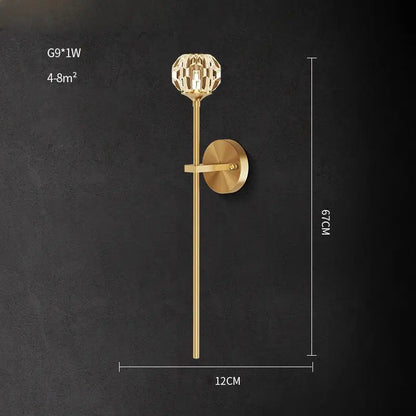 Modern black and gold crystal led wall sconce featuring a gold-toned rod and faceted crystal globe by decorbites