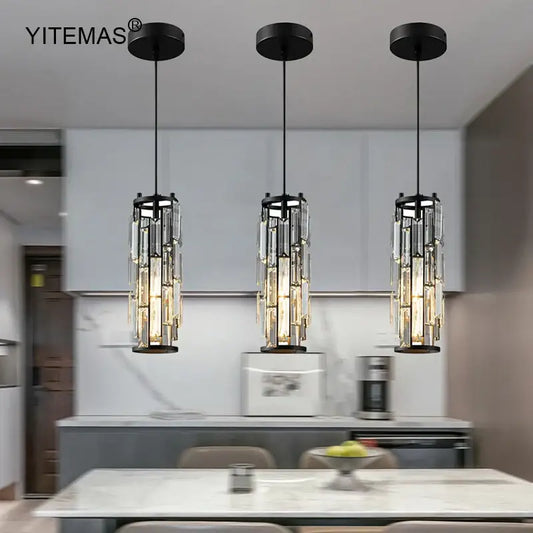 Three black-framed crystal mini pendant lights with cascading rods in a decorbites mini pendant chandelier for kitchen lighting