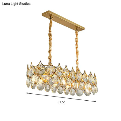Modern black and gold pendant lighting fixture with crystal prism shade and gold-toned chandelier for dining room use
