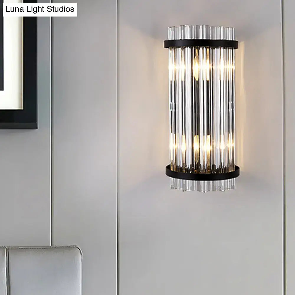 Modern black and gold crystal rod cylinder wall sconce with vertical glass tubes and black metal frame for bedroom lighting