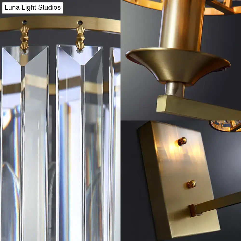 Gold-toned chandelier with clear crystal prisms and brushed brass finish for direct wired electric sconce light fixture use