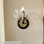 Modern black and gold crystal sconce light with brass base and clear crystal prisms for living room wall lamp