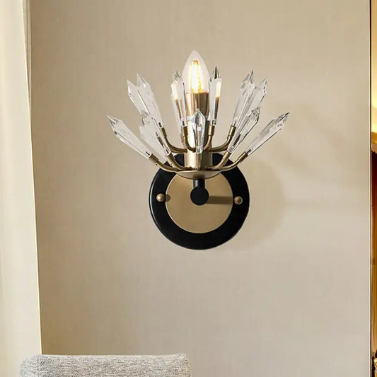 Modern black and gold crystal sconce light with brass base and clear crystal prisms for living room wall lamp