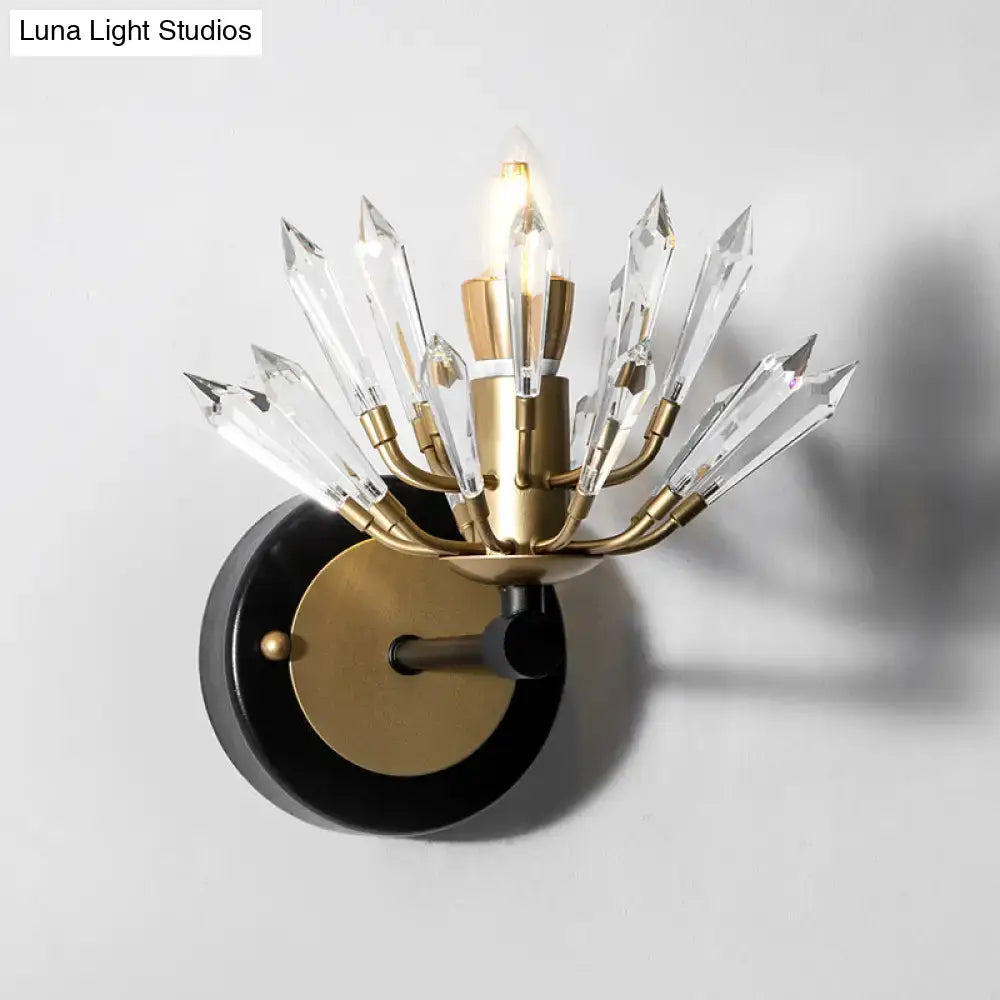 Modern black and gold crystal sconce light with brass and black finish and clear crystal prisms for living room walls