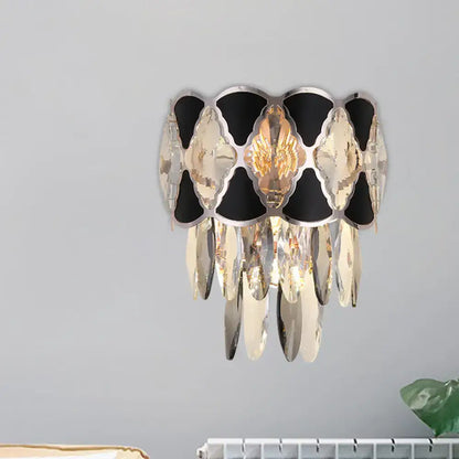 Elegant black and gold crystal wall lamp fixture with cascading mirrored and faceted glass pieces for living room use